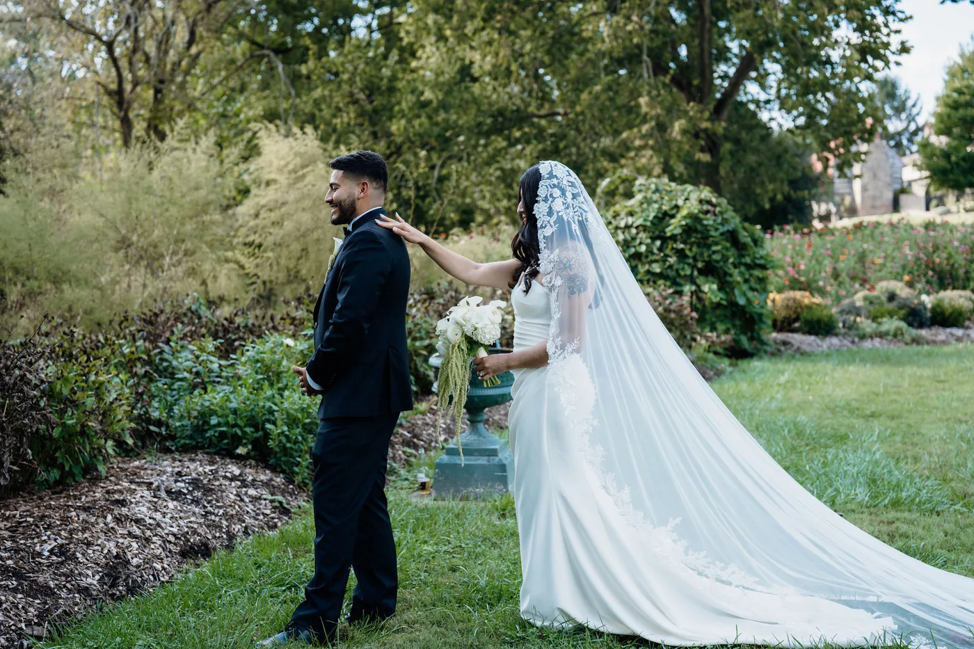Bride and groom during their first look in the gardens at Riverside on the Potomac