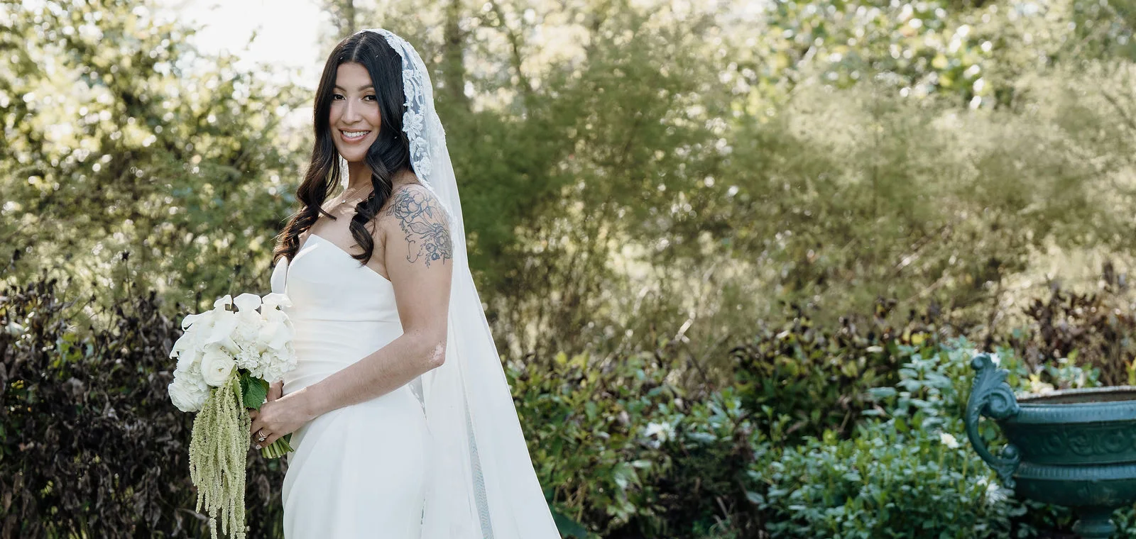 Bride holding a white calla lily and garden rose bouquet with trailing amaranthus at Riverside on the Potomac, Leesburg Virginia