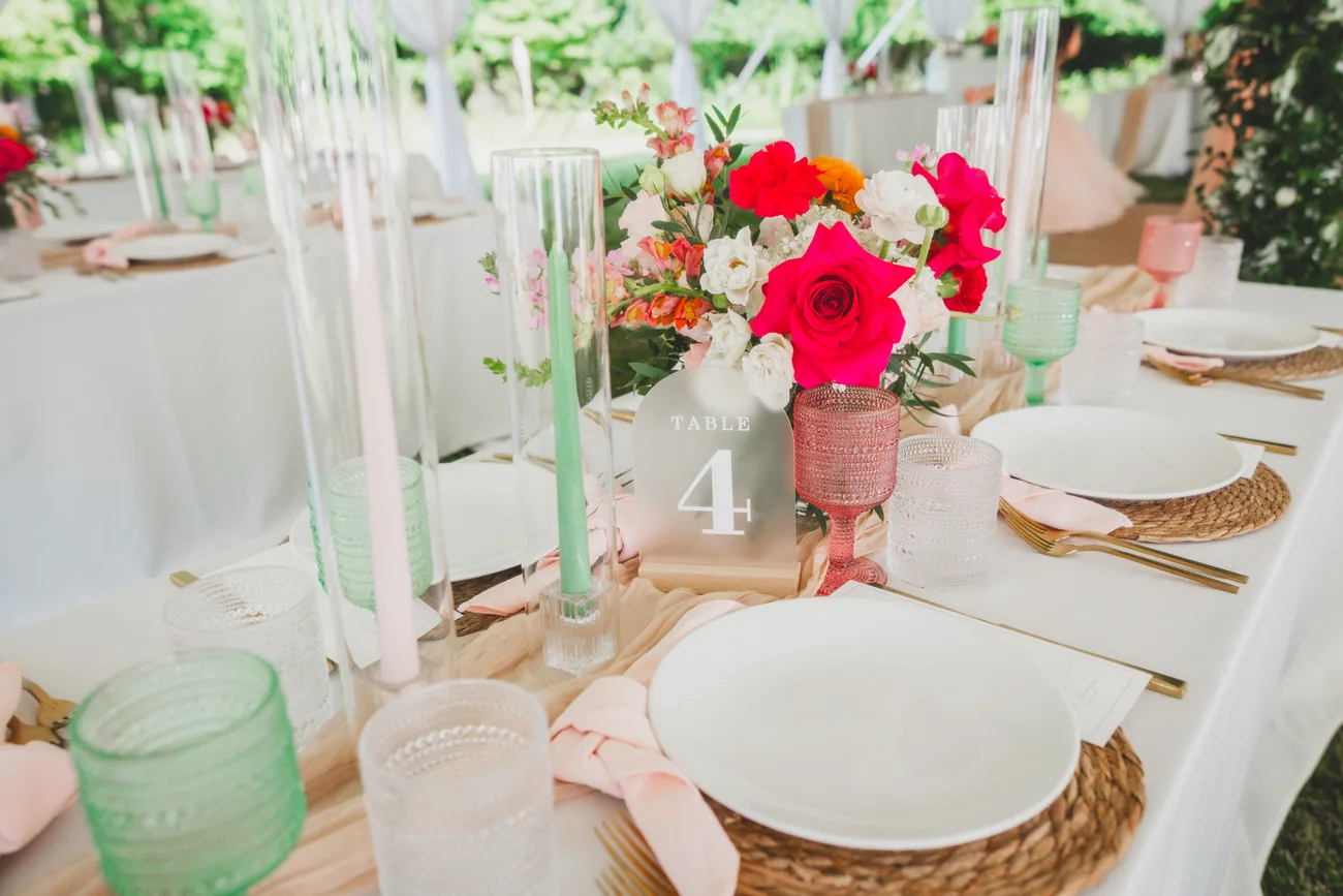 Table florals in hot pink & marigold